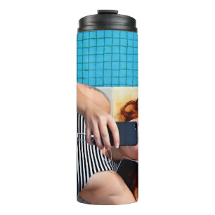 Woman lying on brown floor thermal tumbler