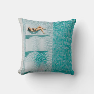Woman lying on lounge cushion