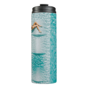 Woman lying on lounge thermal tumbler