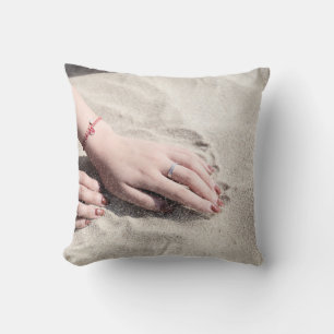 Woman lying on white sand cushion