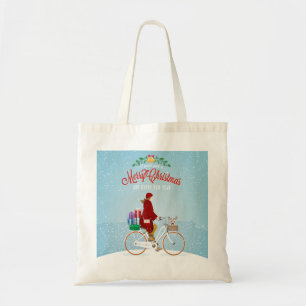 Woman on a Bicycle in Winter Christmas Tote Bag