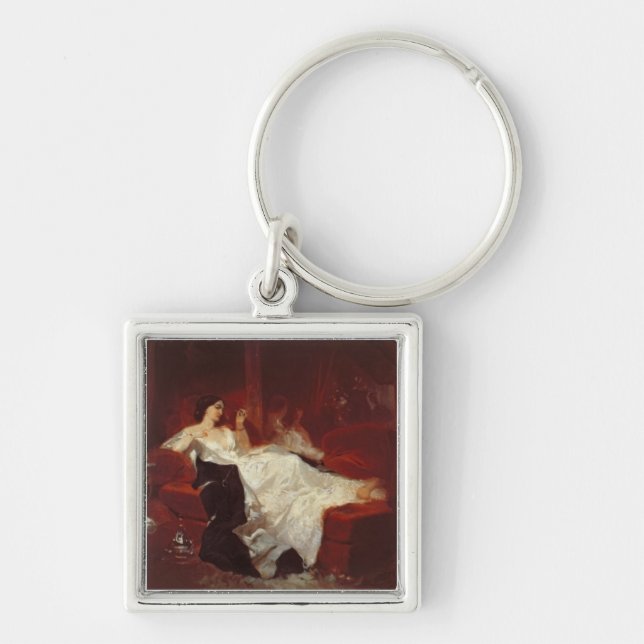 Woman on a red sofa key ring (Front)