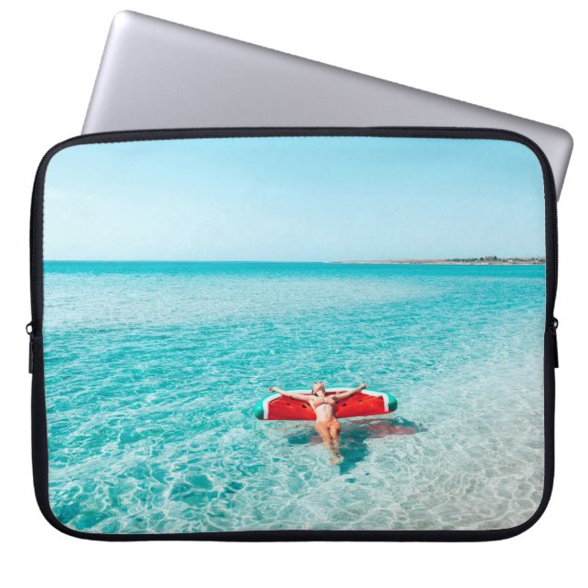 Woman on lilo in the sea water. Girl relaxing on i Laptop Sleeve (Front)