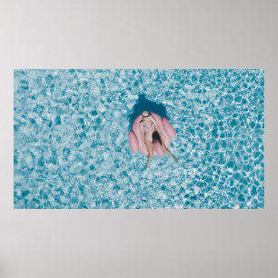 Woman on pink buoy surrounded by body of water in  poster