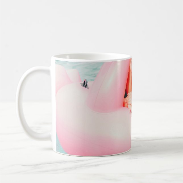 Woman on pink inflatable flamingo on outdoor pool coffee mug (Left)