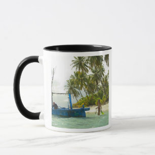Woman on small traditional fishing boat, mug