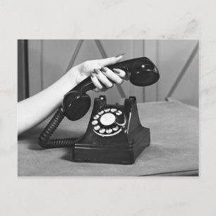 Woman picking up phone close up of hand postcard