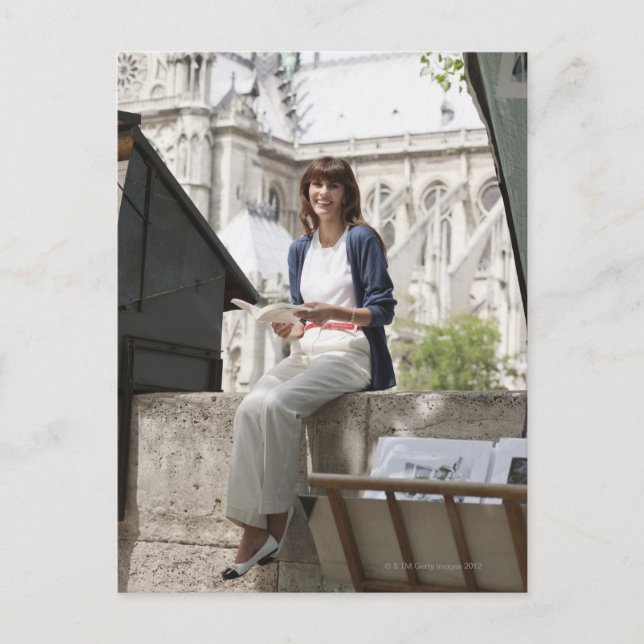 Woman reading a book at a book stall, Notre Dame Postcard (Front)