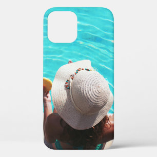 Woman sitting beside swimming pool iPhone 12 case