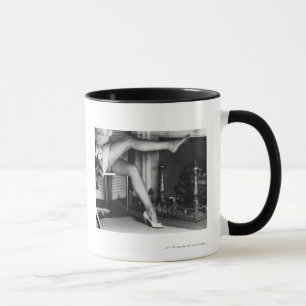 Woman sitting by fireplace B&W Mug