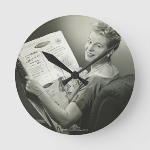 Woman Sitting in Chair Round Clock