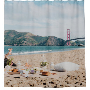 Woman sitting near seashore while looking at Golde Shower Curtain