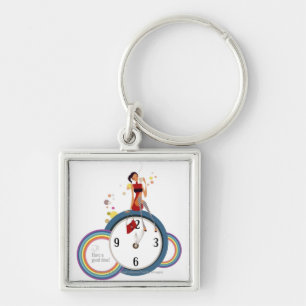 Woman sitting on a clock and holding a tea cup key ring