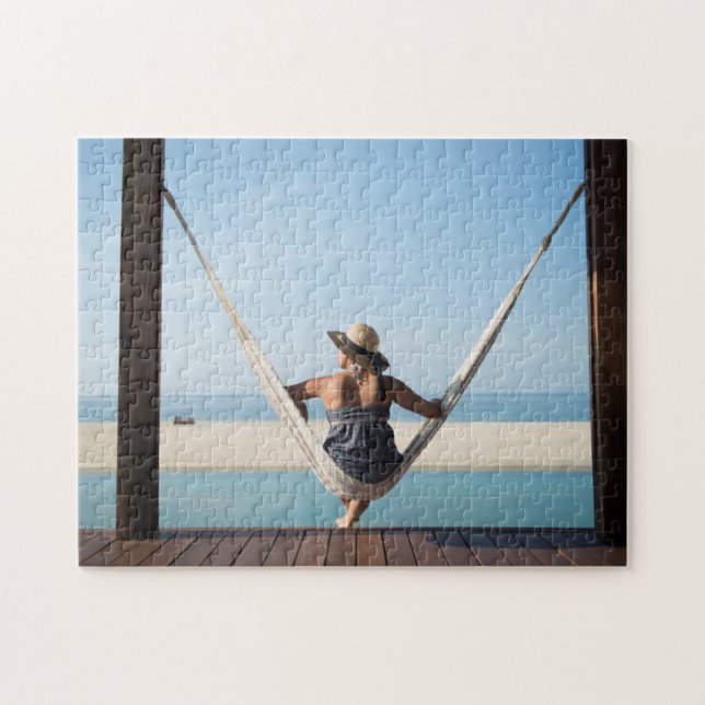 Woman Sitting On A Hammock At A Small Hotel Jigsaw Puzzle (Horizontal)