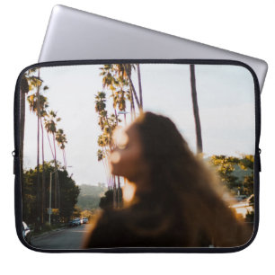 Woman standing near outdoor in the morning laptop sleeve