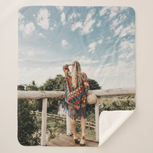Woman standing on terrace sherpa blanket