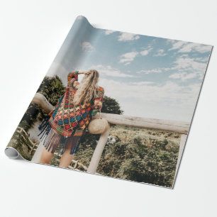 Woman standing on terrace wrapping paper