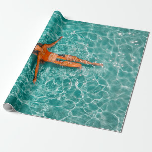 Woman swimming alone in body of water wrapping paper