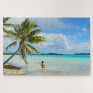 Woman under a palm tree in the Pacific Jigsaw Puzzle