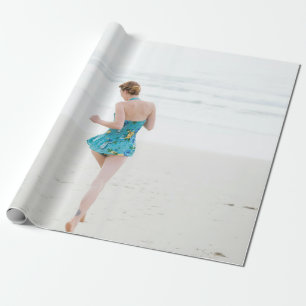 Woman walking on shore near beach wrapping paper