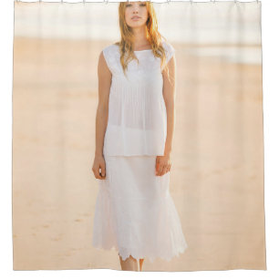 Woman walking on the shore shower curtain
