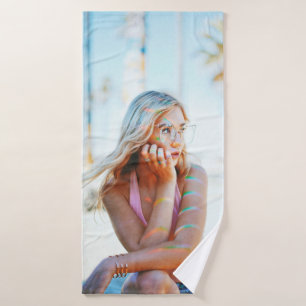 Woman waving her hair by the wind bath towel