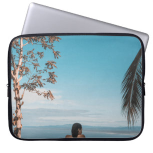 Woman wearing black bikini tap swimming on body of laptop sleeve