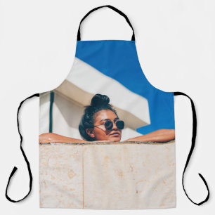 Woman wearing black sunglasses apron