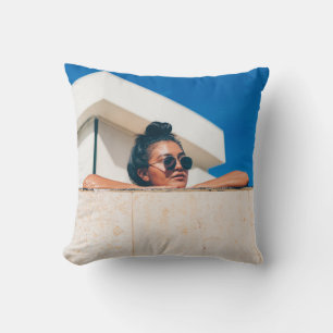 Woman wearing black sunglasses cushion