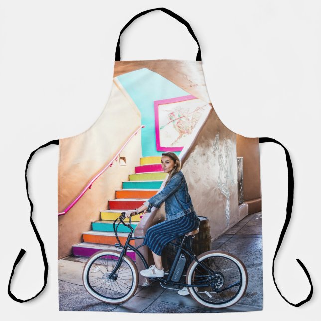 Woman wearing blue denim jacket and shorts riding  apron (Front)