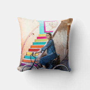 Woman wearing blue denim jacket and shorts riding  cushion