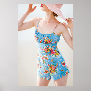 Woman wearing blue floral rompers and brown hat poster