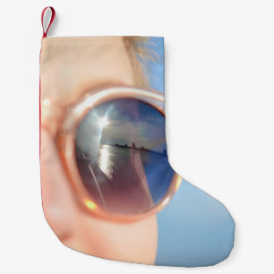 Woman wearing brown framed sunglasses small christmas stocking