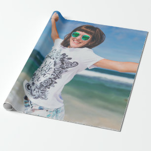 Woman wearing white and black shirt jumping near s wrapping paper