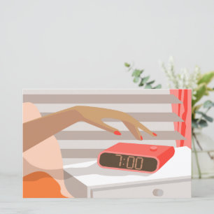 Womans hand pushing on alarm clock snooze button