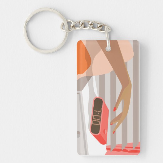 Womans hand pushing on alarm clock snooze button key ring (Front)