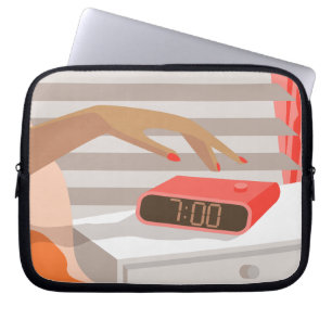 Womans hand pushing on alarm clock snooze button laptop sleeve