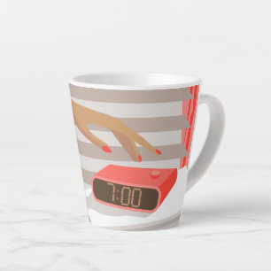 Womans hand pushing on alarm clock snooze button latte mug