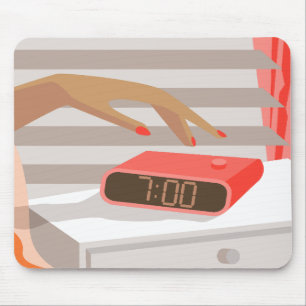 Womans hand pushing on alarm clock snooze button mouse pad
