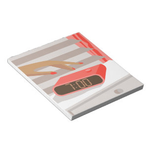 Womans hand pushing on alarm clock snooze button notepad