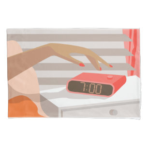 Womans hand pushing on alarm clock snooze button pillowcase