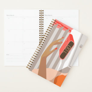 Womans hand pushing on alarm clock snooze button planner