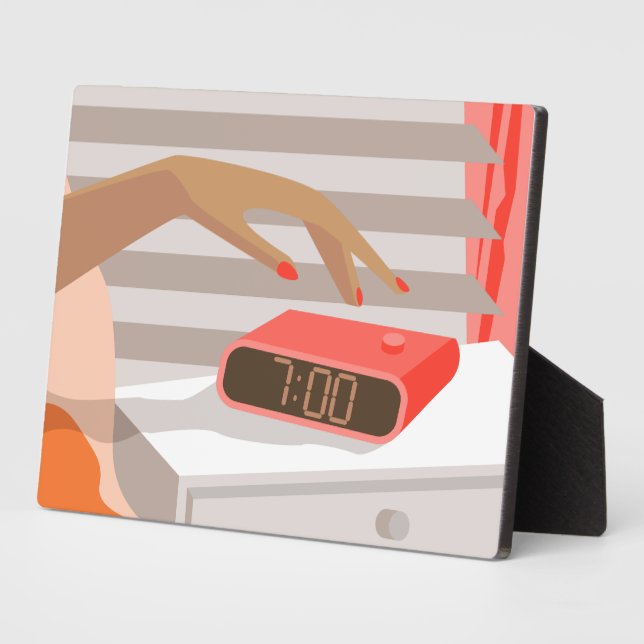 Womans hand pushing on alarm clock snooze button plaque (Side)