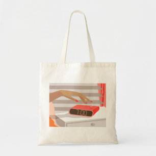 Womans hand pushing on alarm clock snooze button tote bag