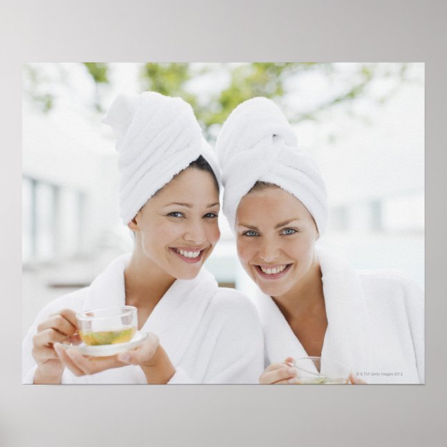 Women in bathrobes drinking tea at spa poster (Front)