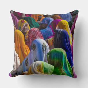 Women in colourful saris gather together cushion