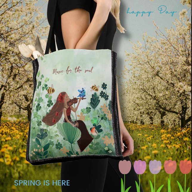 Women in meadow playing a violin tote bag (Women in meadow playing a violin tote bag)