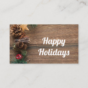 wooden background with pine cones business card