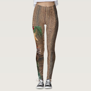 wooden background with pine cones leggings
