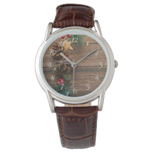 wooden background with pine cones watch
